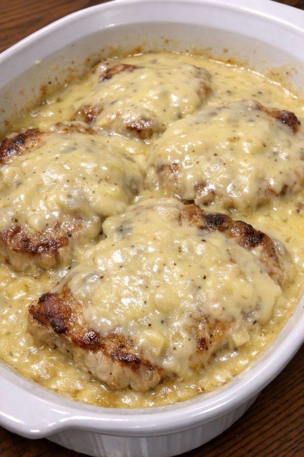 Golden-browned pork chops in creamy chicken gravy