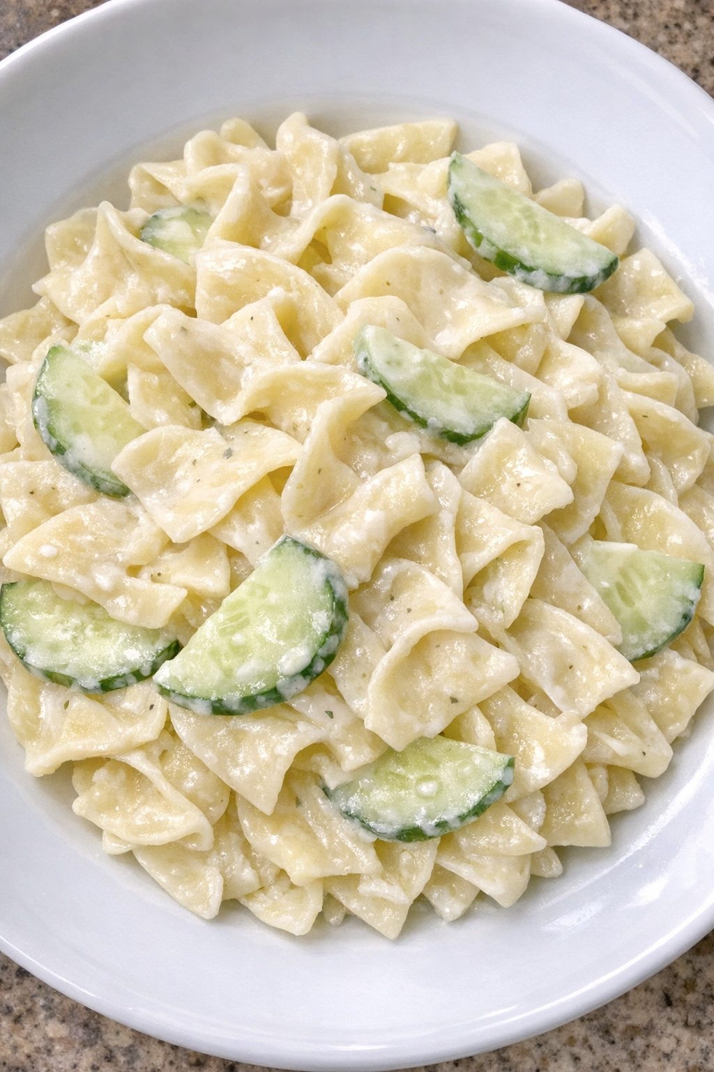 Slow cooker Amish cucumber cream noodles on a white plate