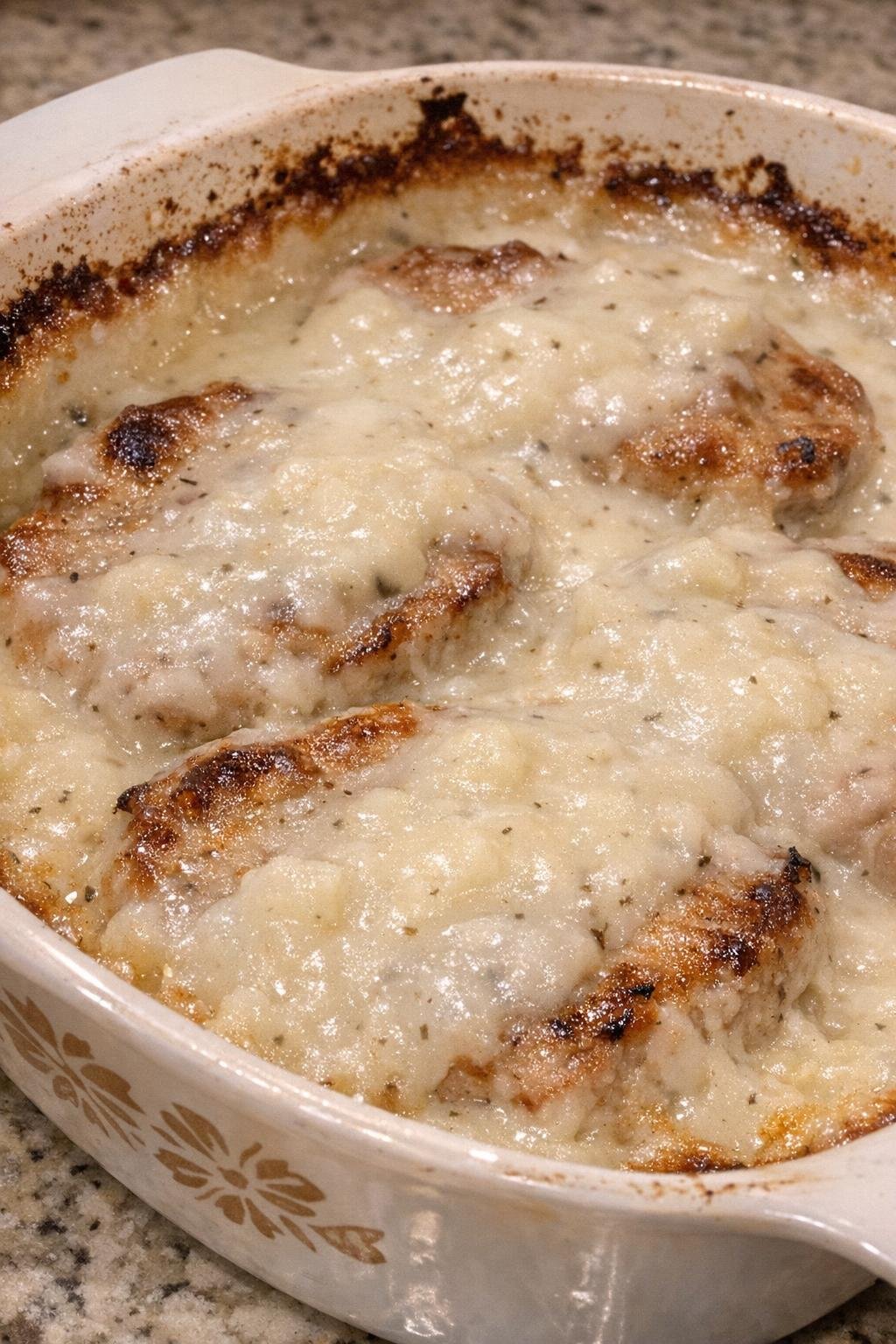 Tender pork chops baked in creamy potato soup sauce