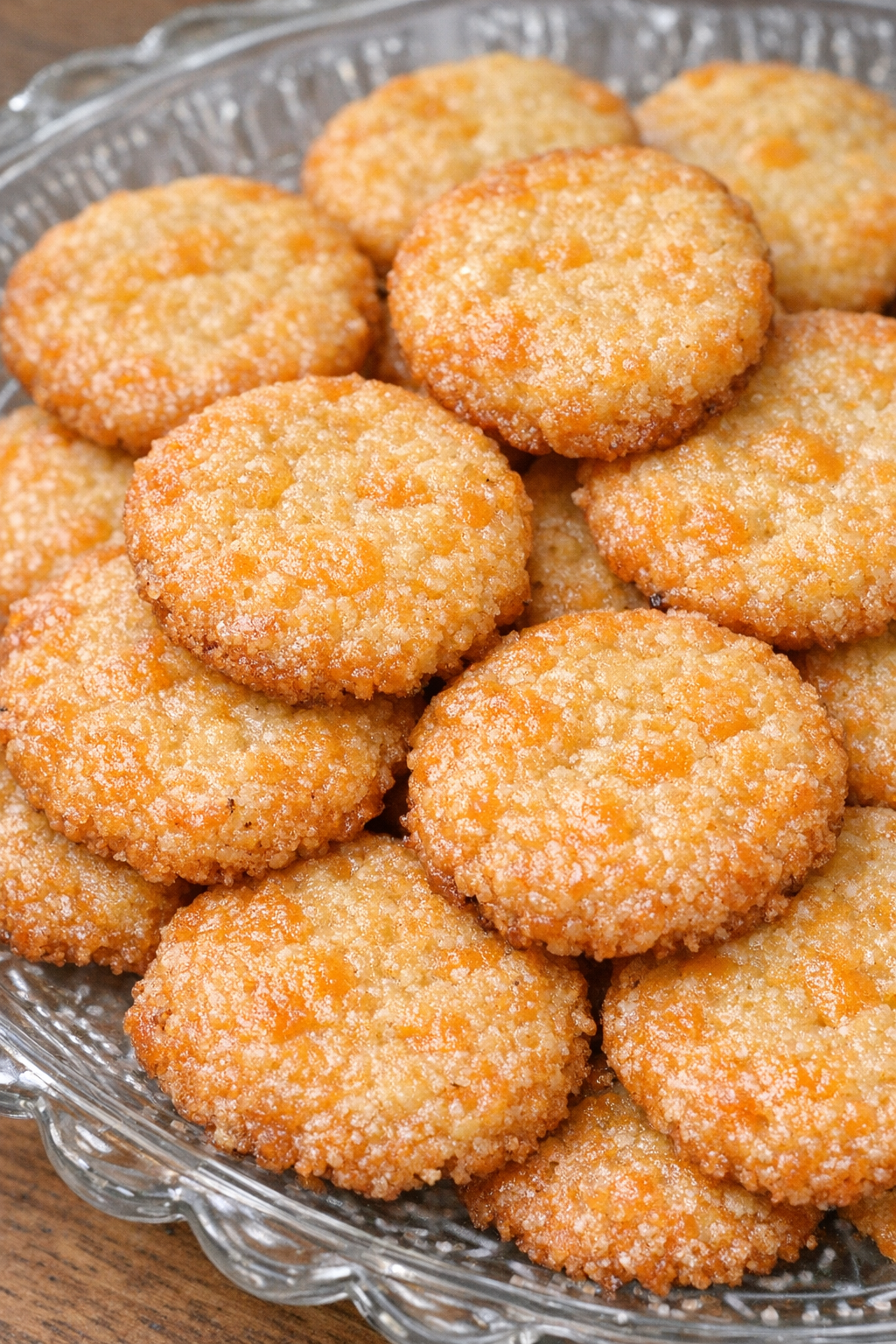 Southern 4-ingredient cheese pennies on a glass serving platter
