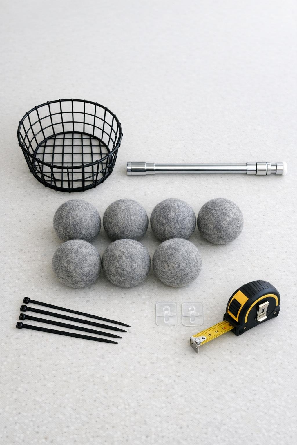 Materials for a hanging dryer ball holder laid out on a countertop