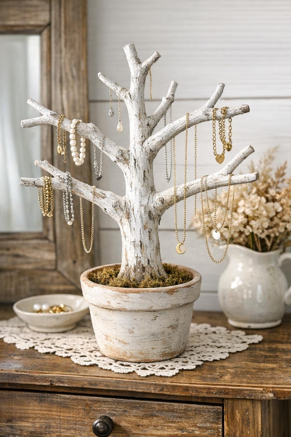 Finished rustic jewelry tree holding necklaces and bracelets