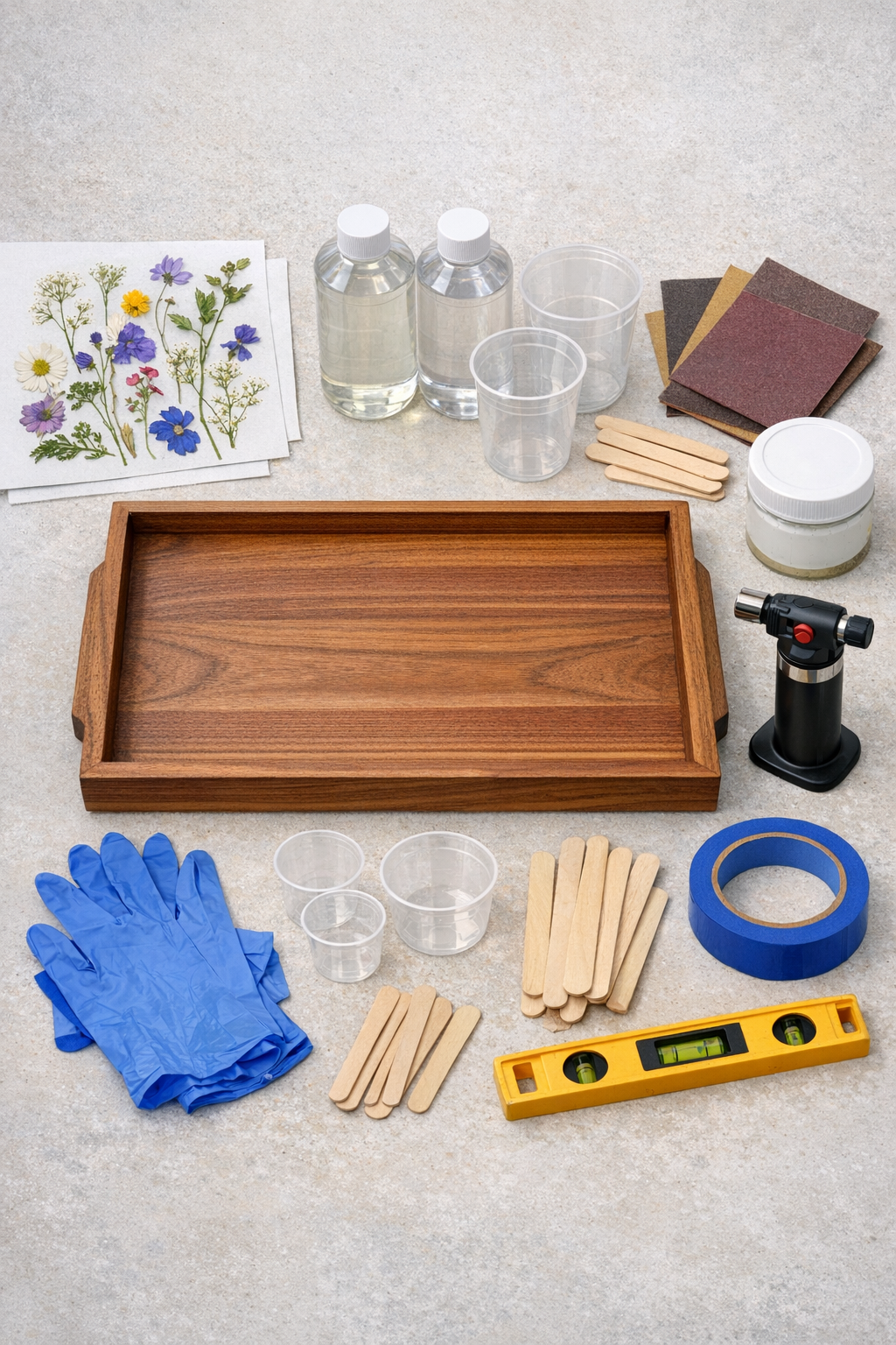 Materials for making a wildflower epoxy serving tray laid out neatly