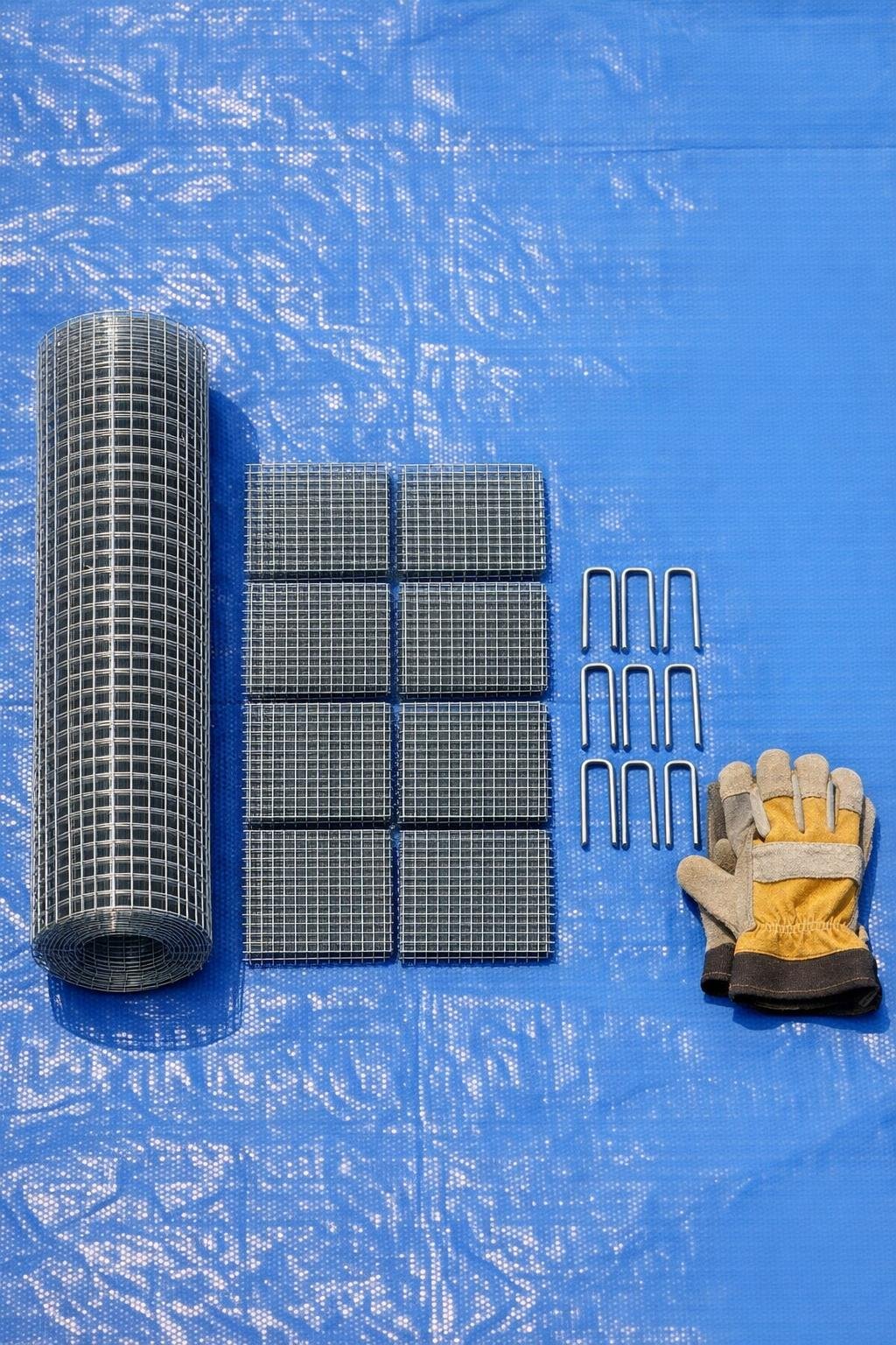Materials for making raised bed corner braces laid out on a tarp