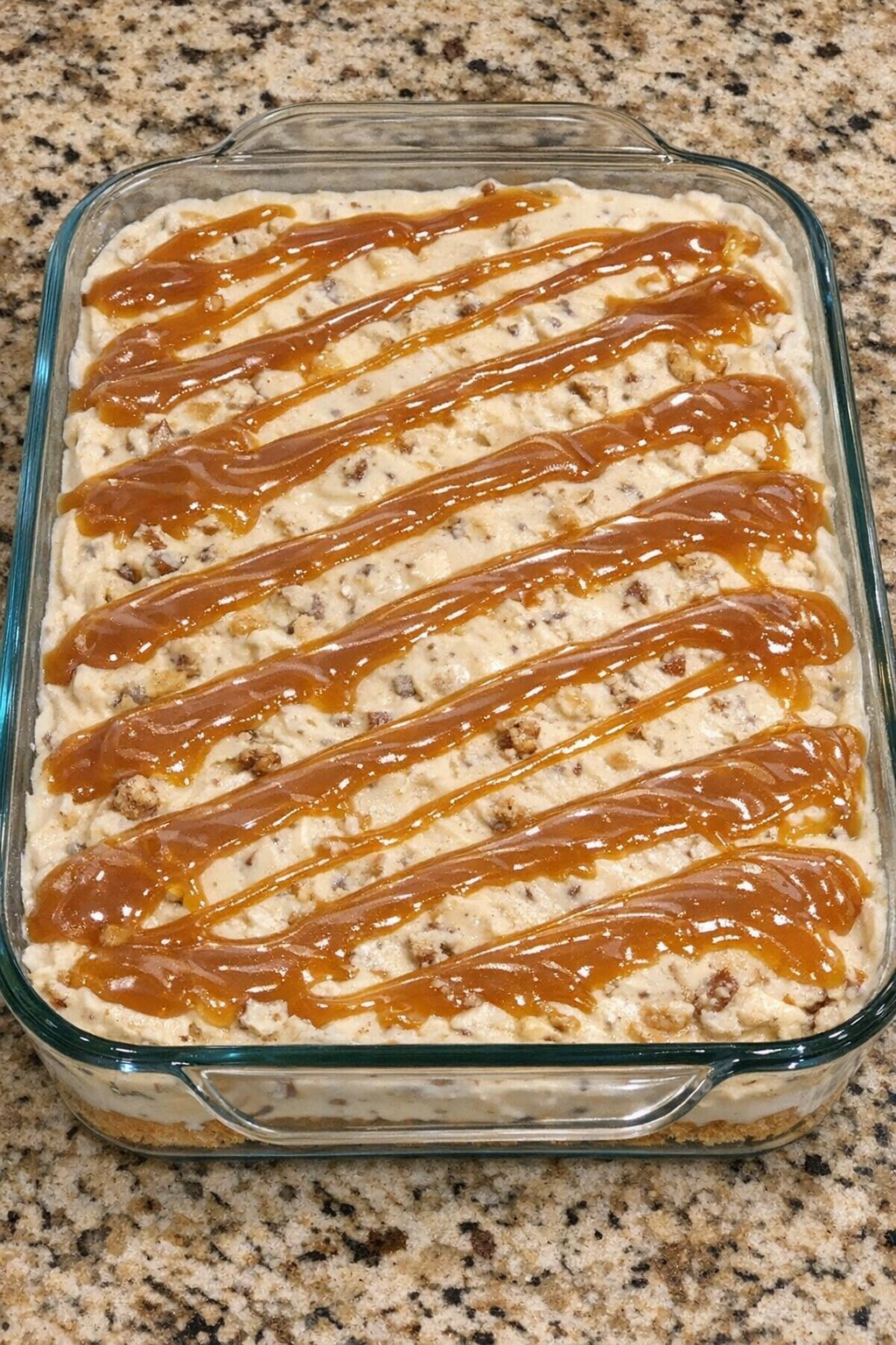 Frozen butter pecan bars in a glass casserole dish