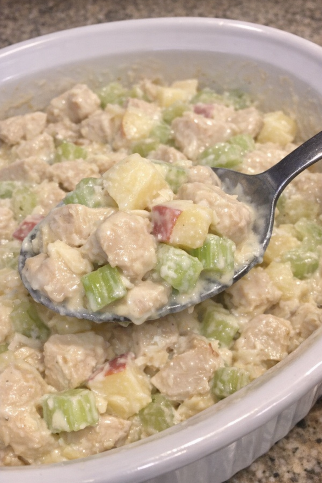 Creamy chicken Waldorf casserole in a white dish