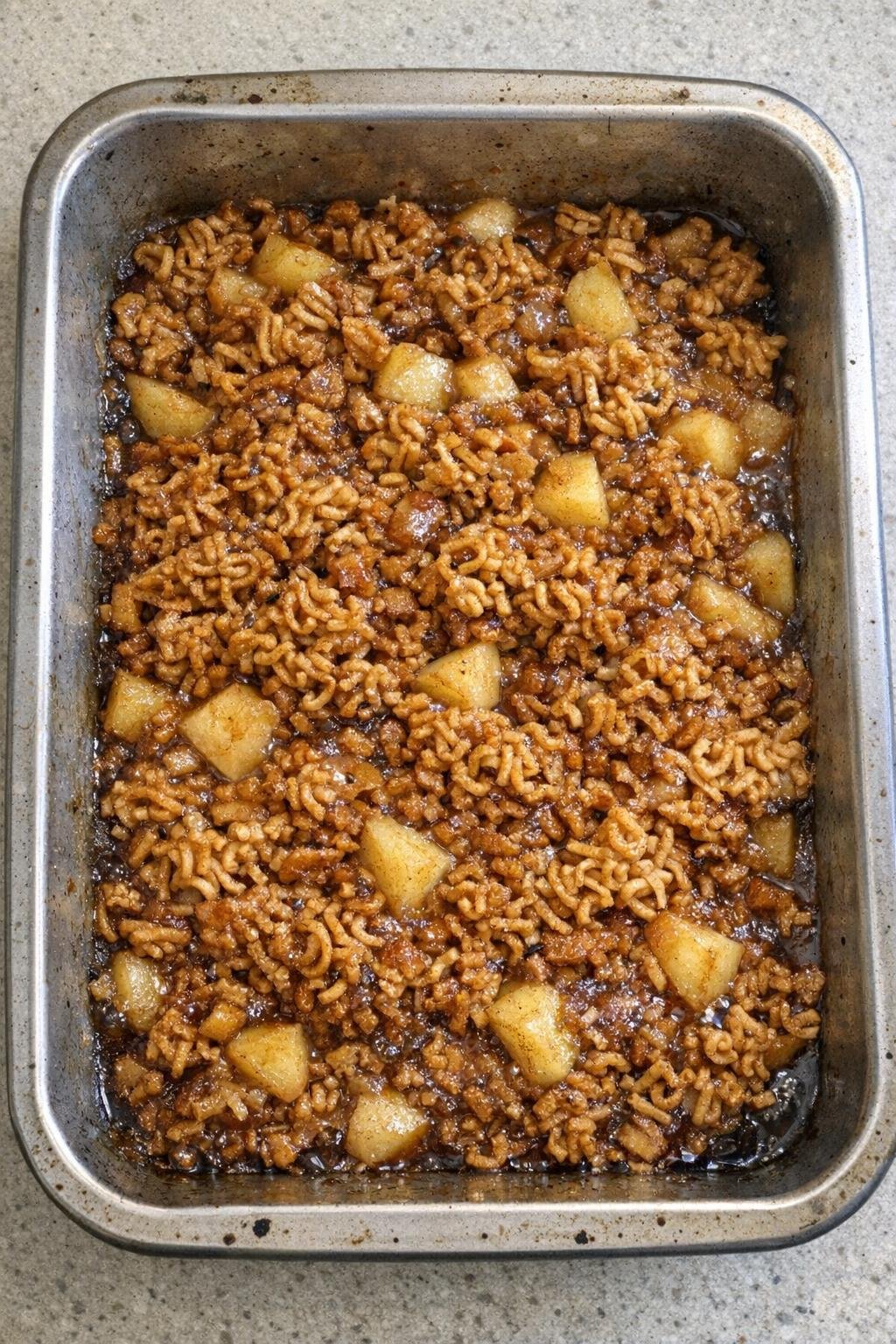 Finished baked ramen apple dessert in a roasting pan