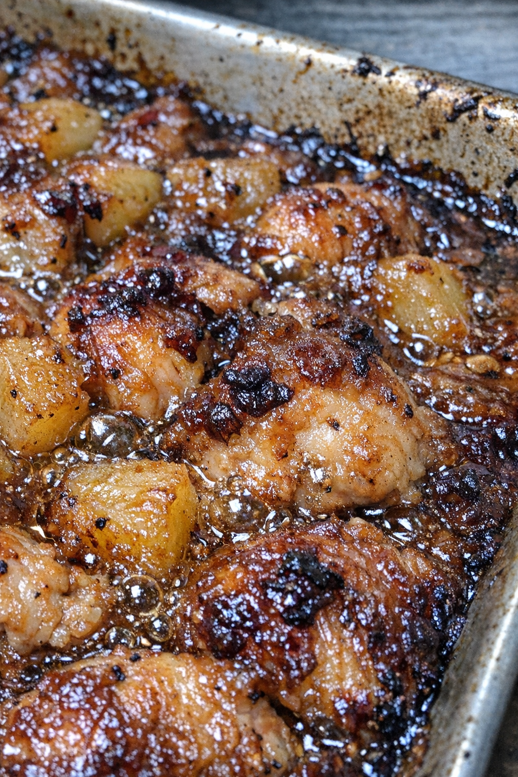 Bubbling caramelized holiday weekend bake in a metal baking sheet