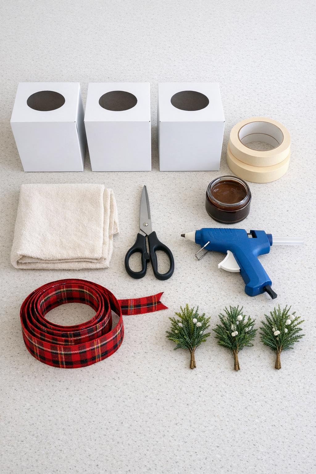 Materials for the tissue box tape craft laid out on a counter
