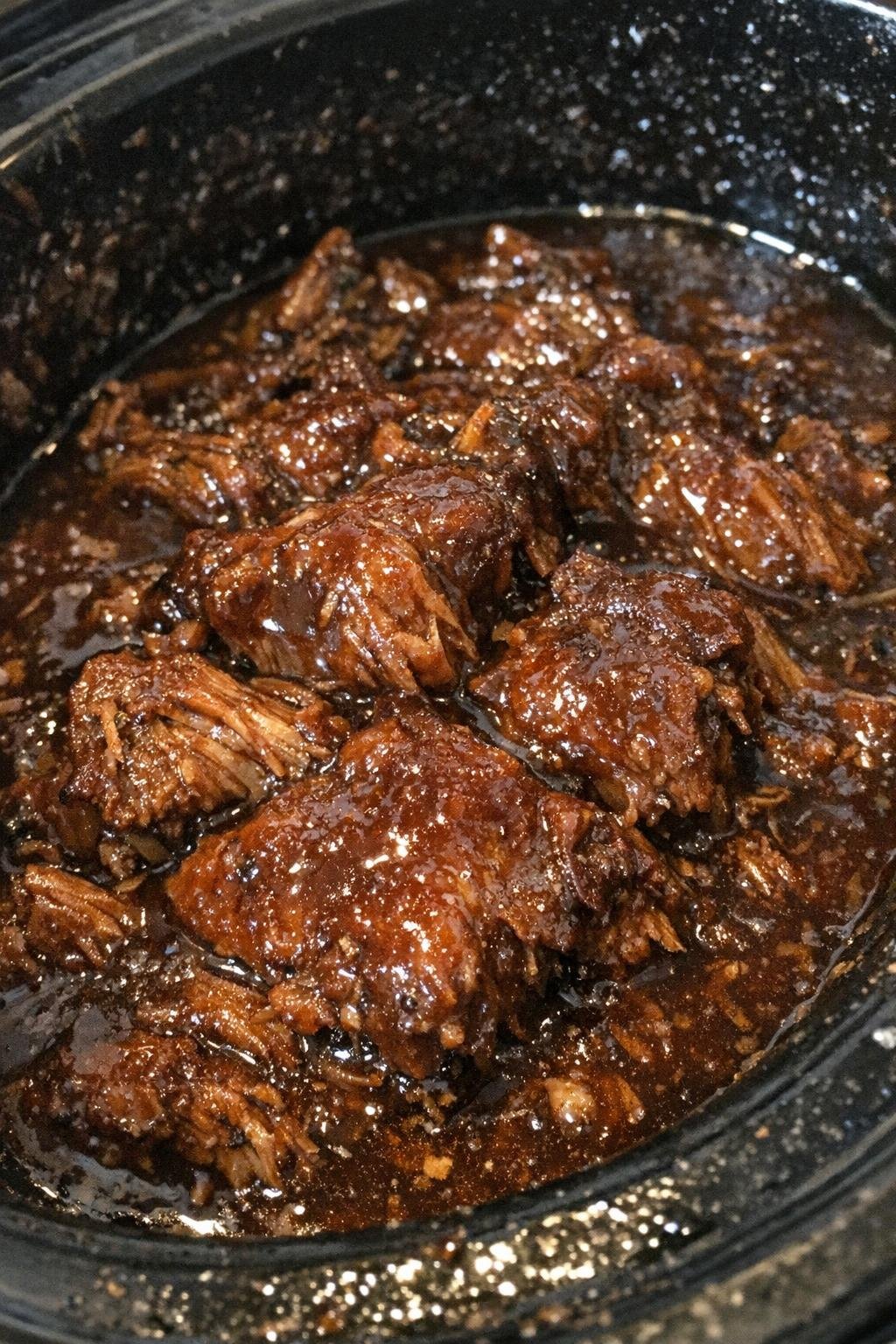 Slow cooker spooky season comfort in dark amber sauce