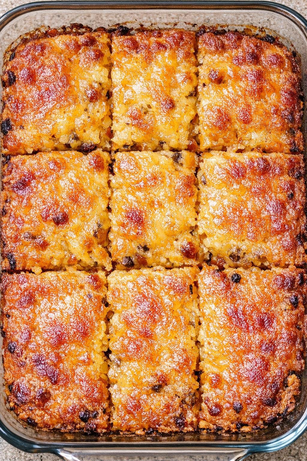 Southern 3-ingredient golden chili squares baked in a glass casserole dish