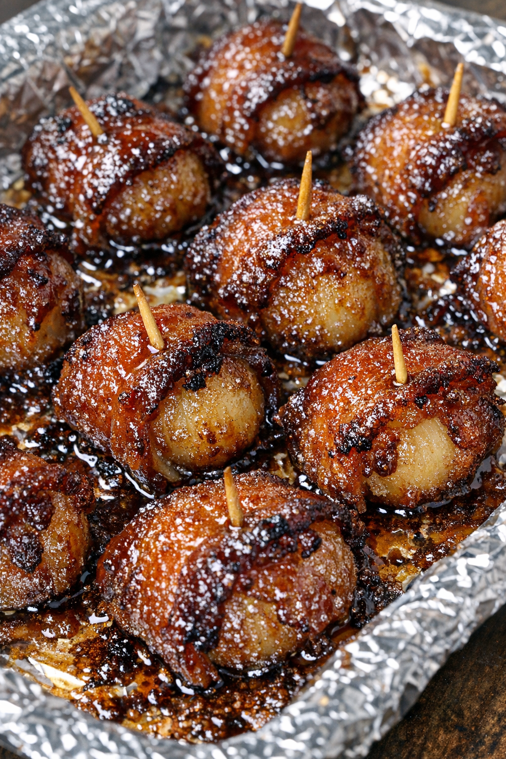 Southern 3-ingredient bacon wrapped water chestnuts on a foil-lined baking tray