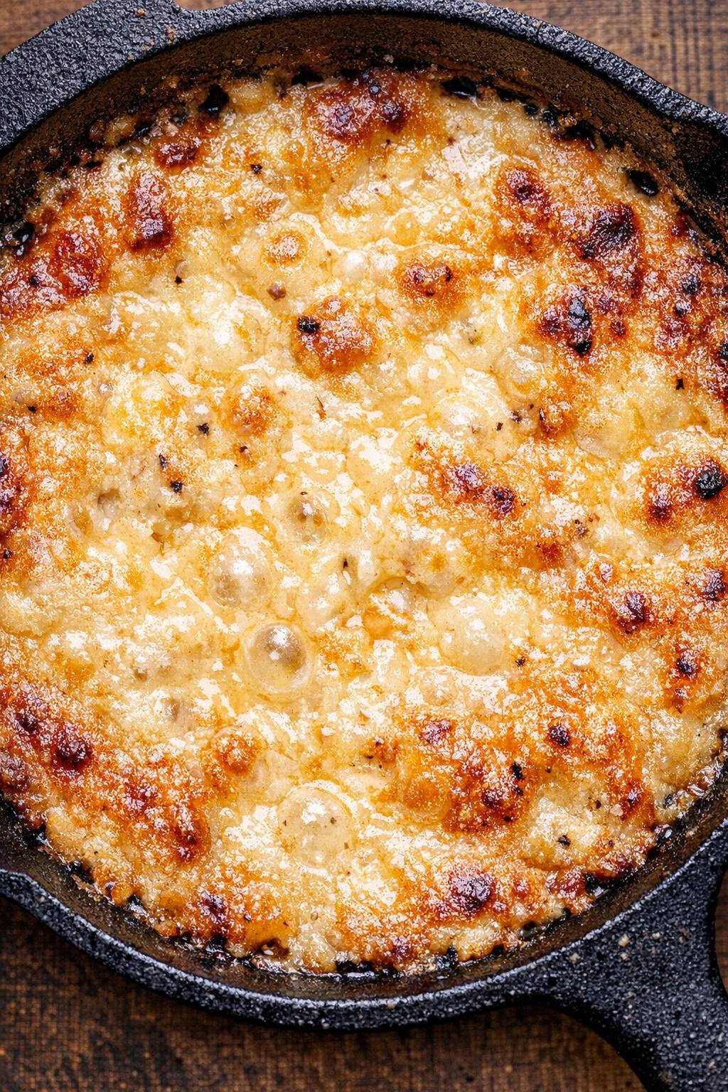 Southern 4-ingredient beer cheese dip bubbling in a cast iron skillet