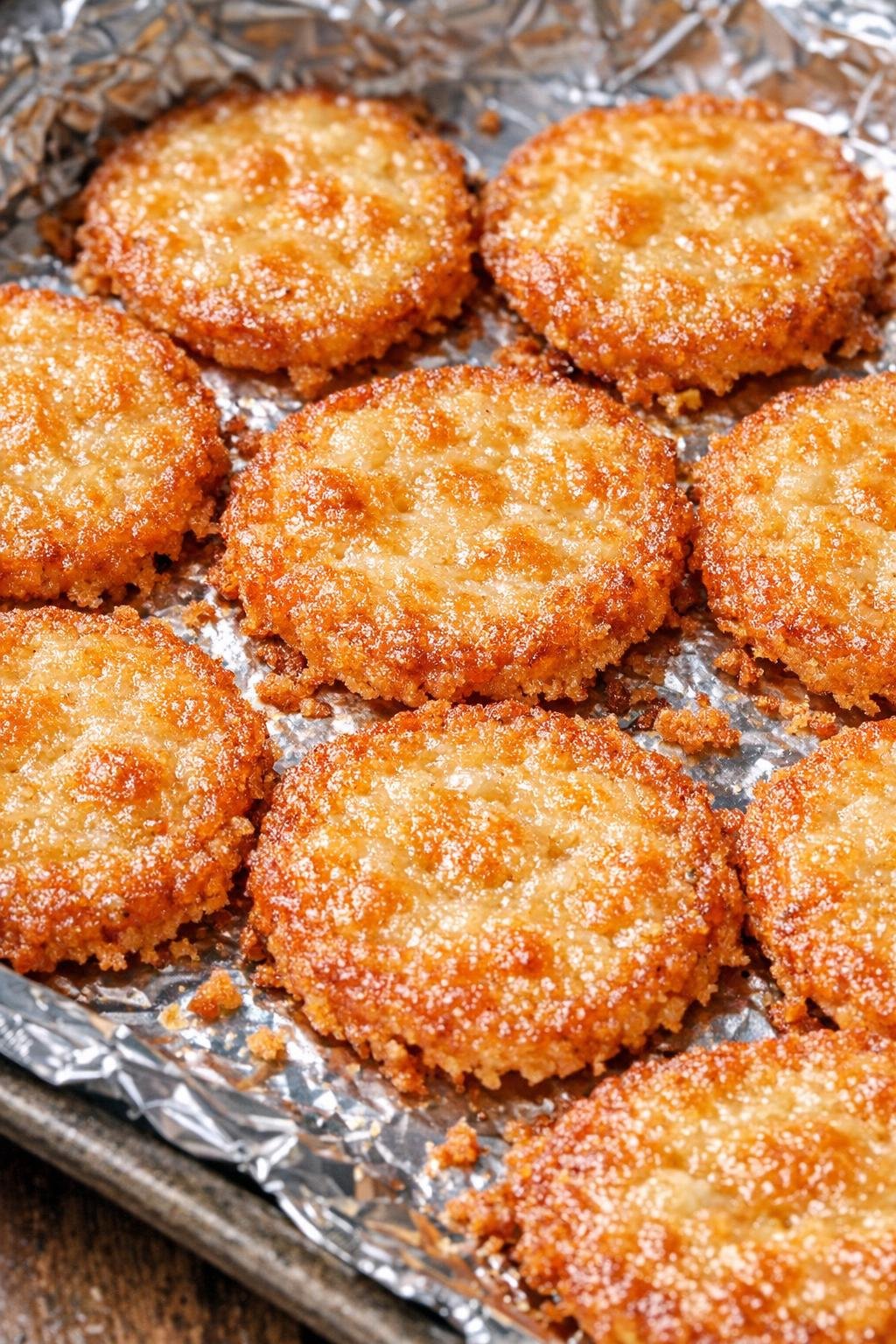Southern 3-ingredient crispy parmesan pennies on a foil-lined baking tray