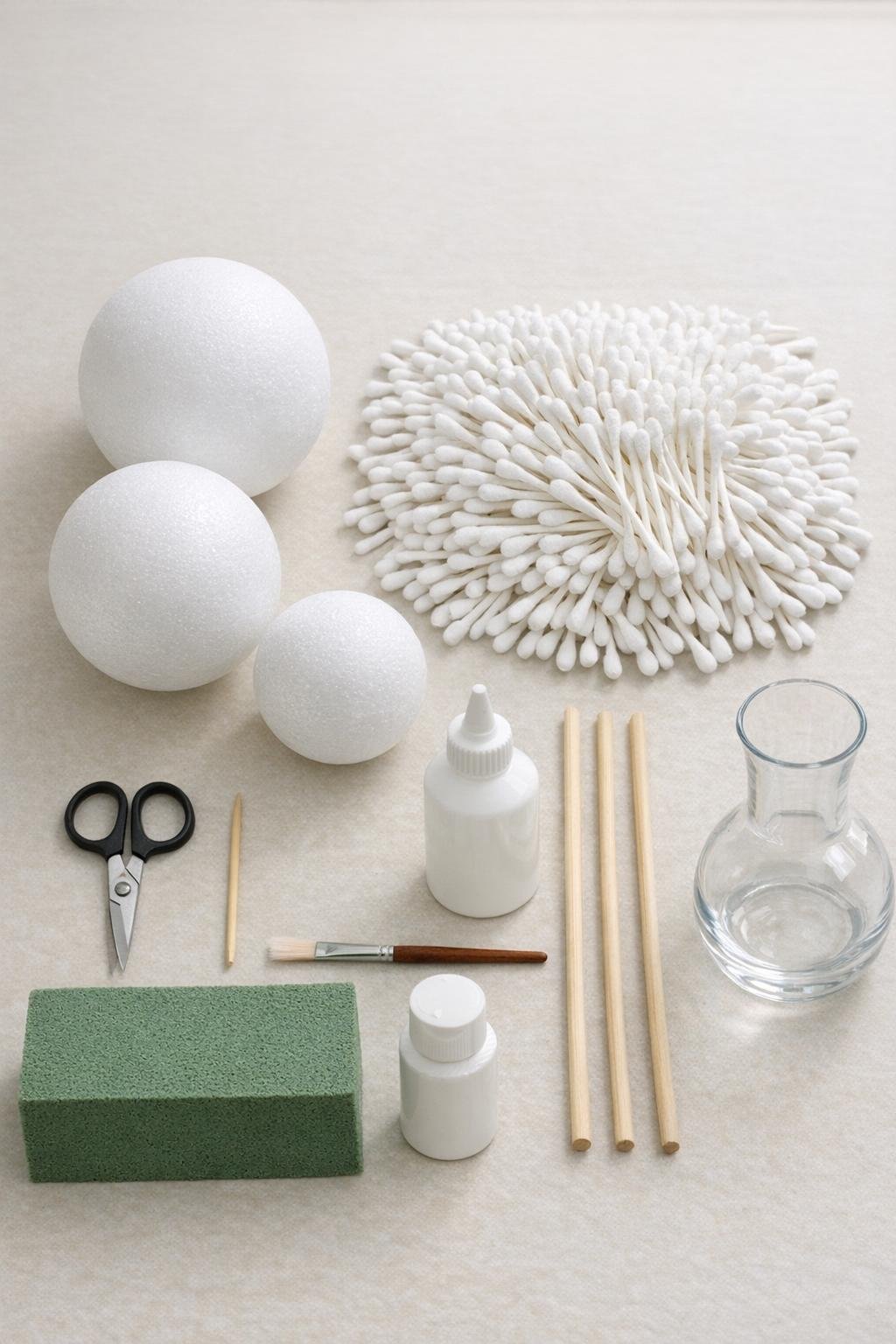 Materials for cotton swab dandelion spheres laid out on a craft table