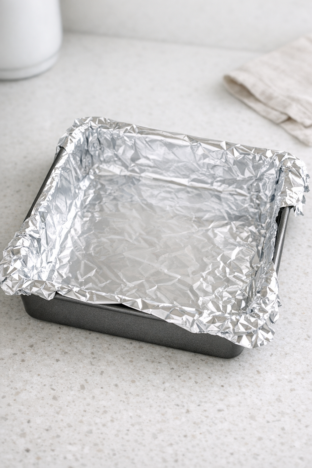 Foil-lined pan prepared for fudge