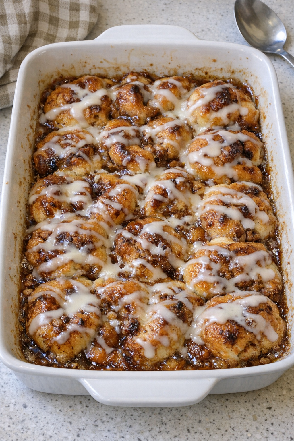 Baked cinnamon roll dessert in a casserole dish