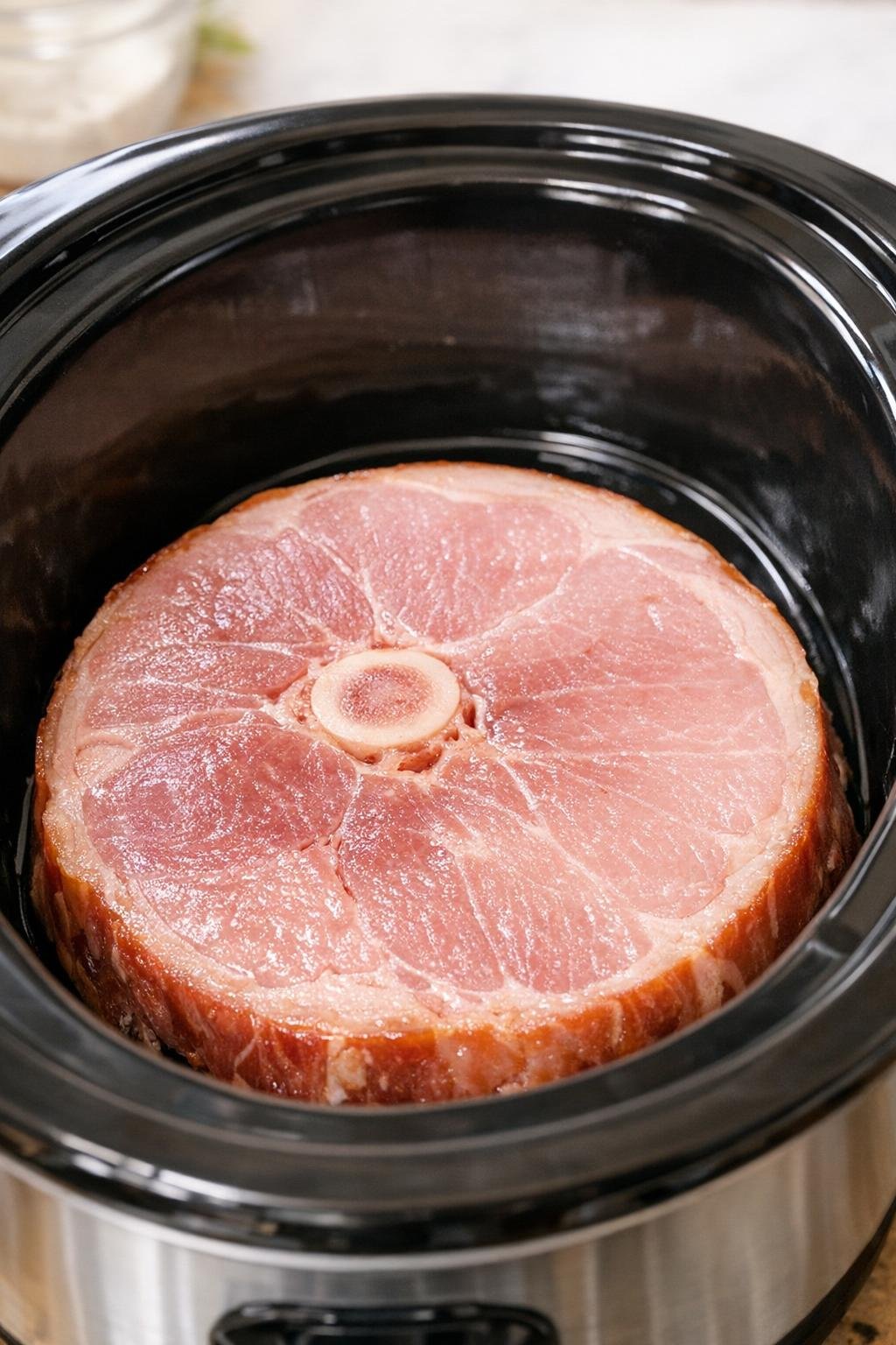 Ham steak placed in slow cooker