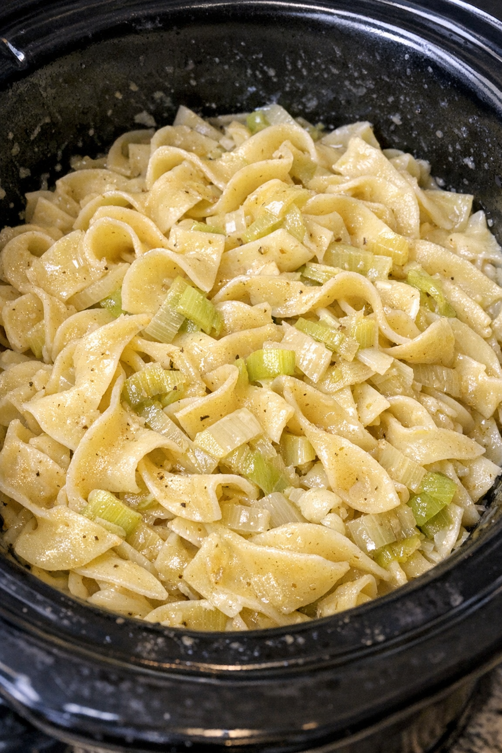 Slow cooker Amish leek noodles in a black slow cooker