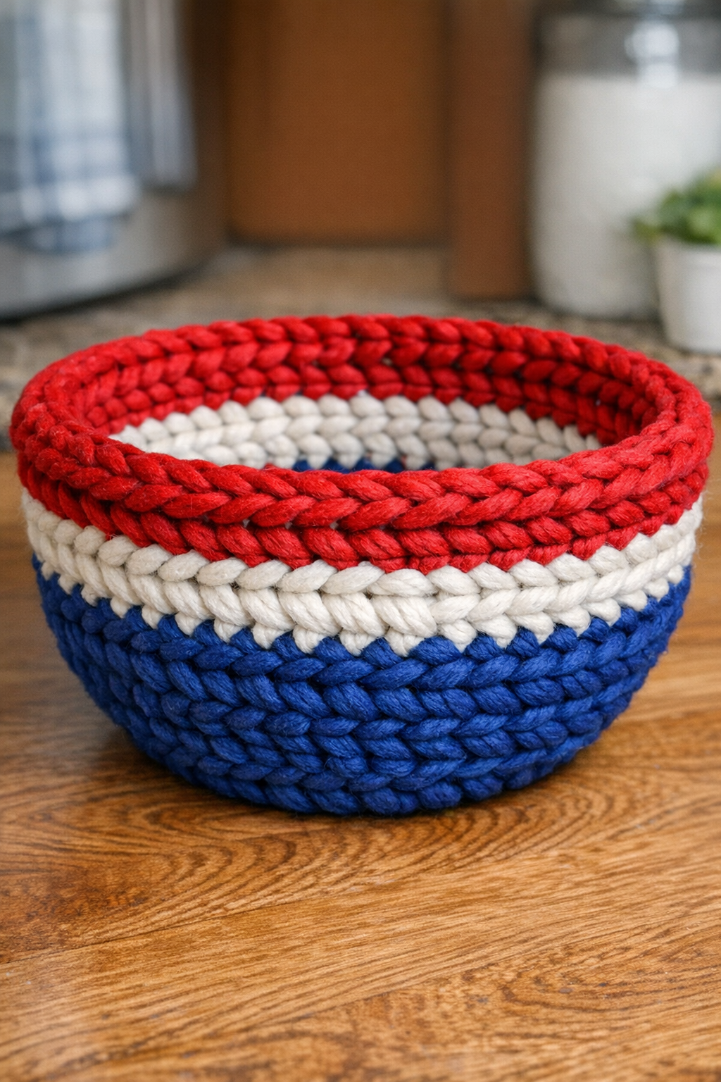 Finished patriotic yarn-wrapped serving bowl made from a plastic colander
