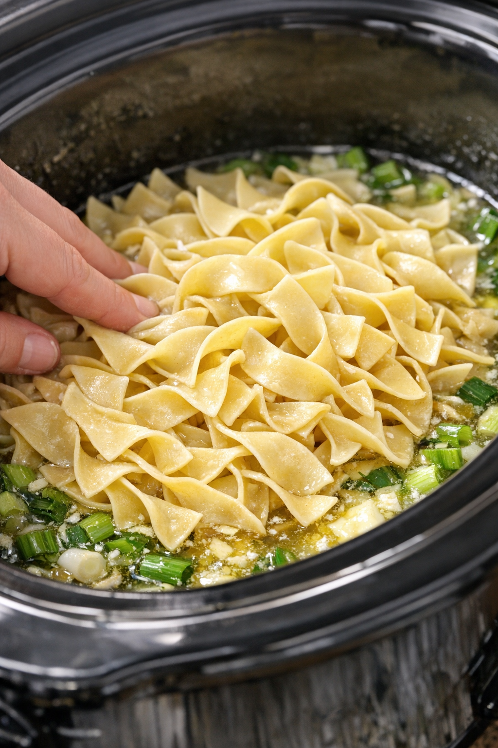 Egg noodles added to the slow cooker