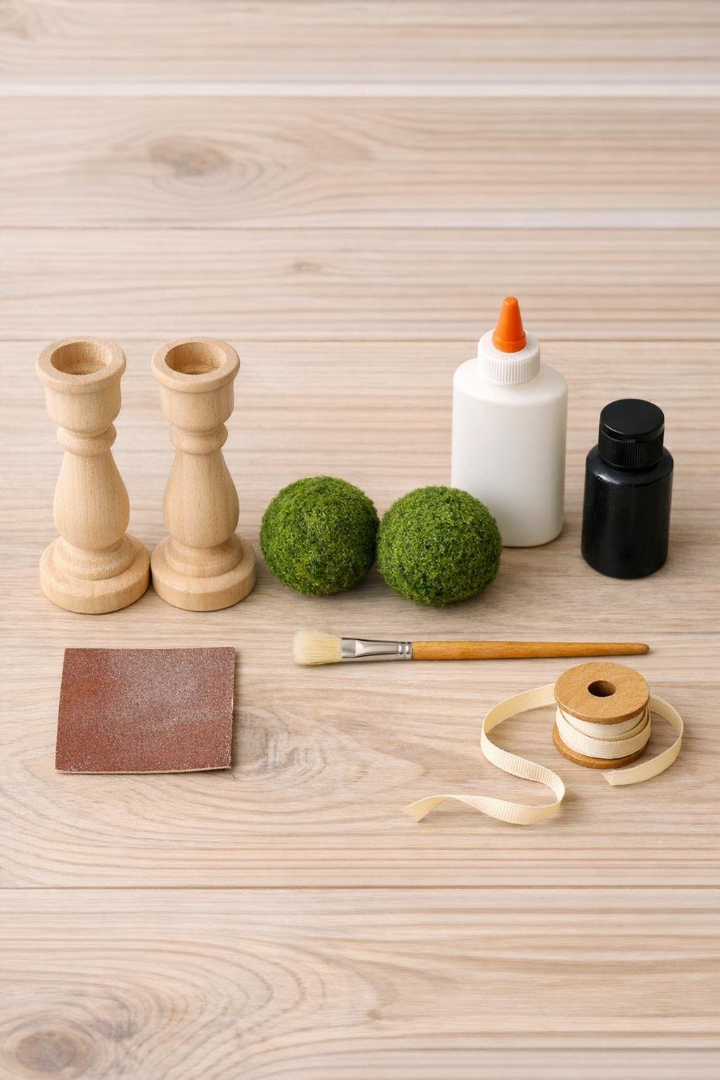 Materials for the autumn candlestick moss ball display laid out neatly