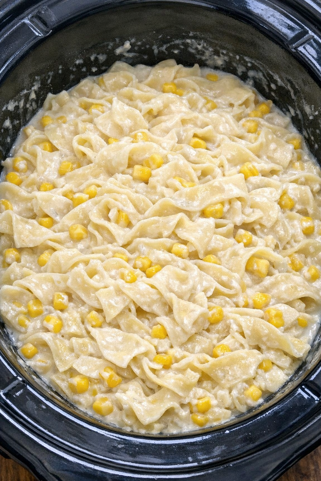Slow cooker Amish corn cream noodles ready to serve