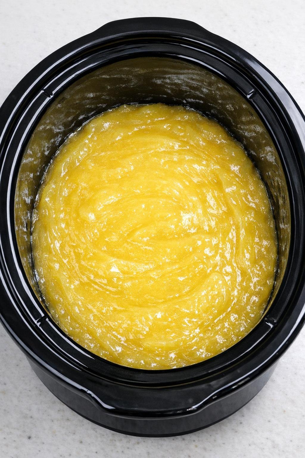 Lemon pie filling spread in the slow cooker