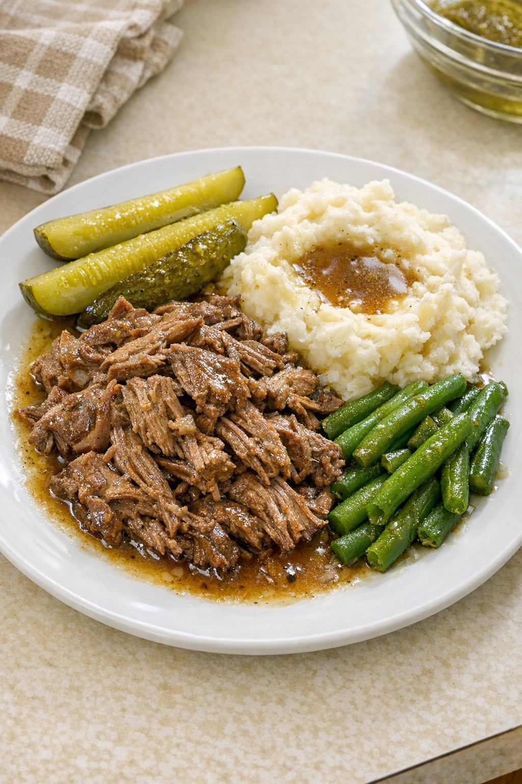 Finished plated Amish pickle beef with tender shredded beef and pickles