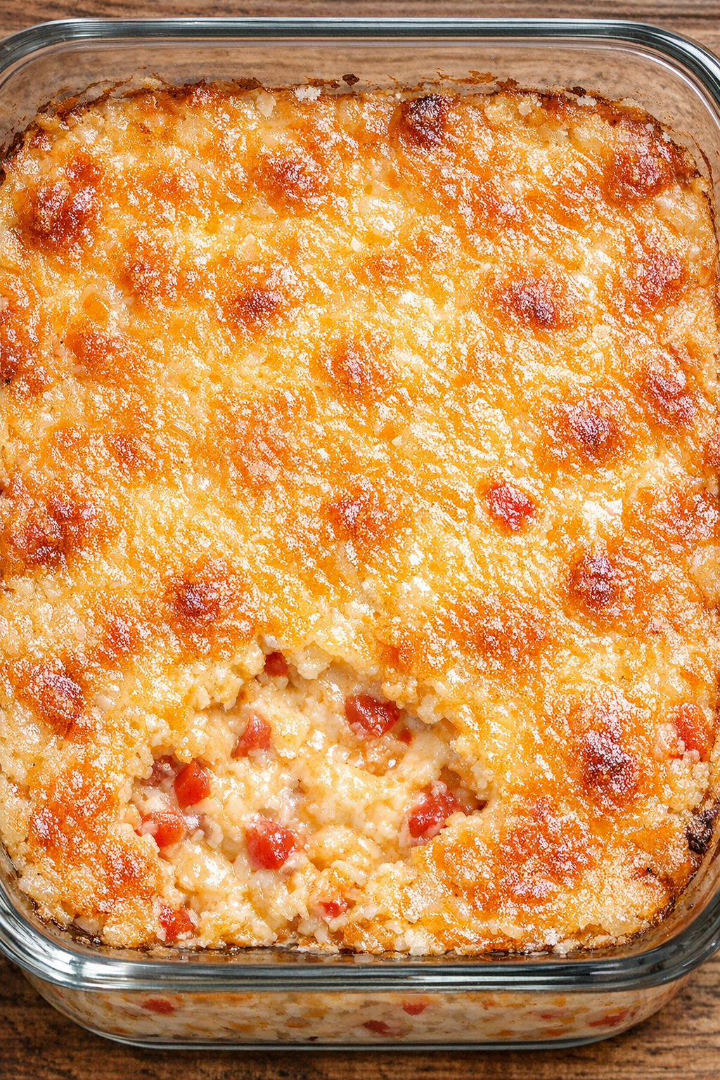 Southern baked pimento cheese in a glass casserole dish