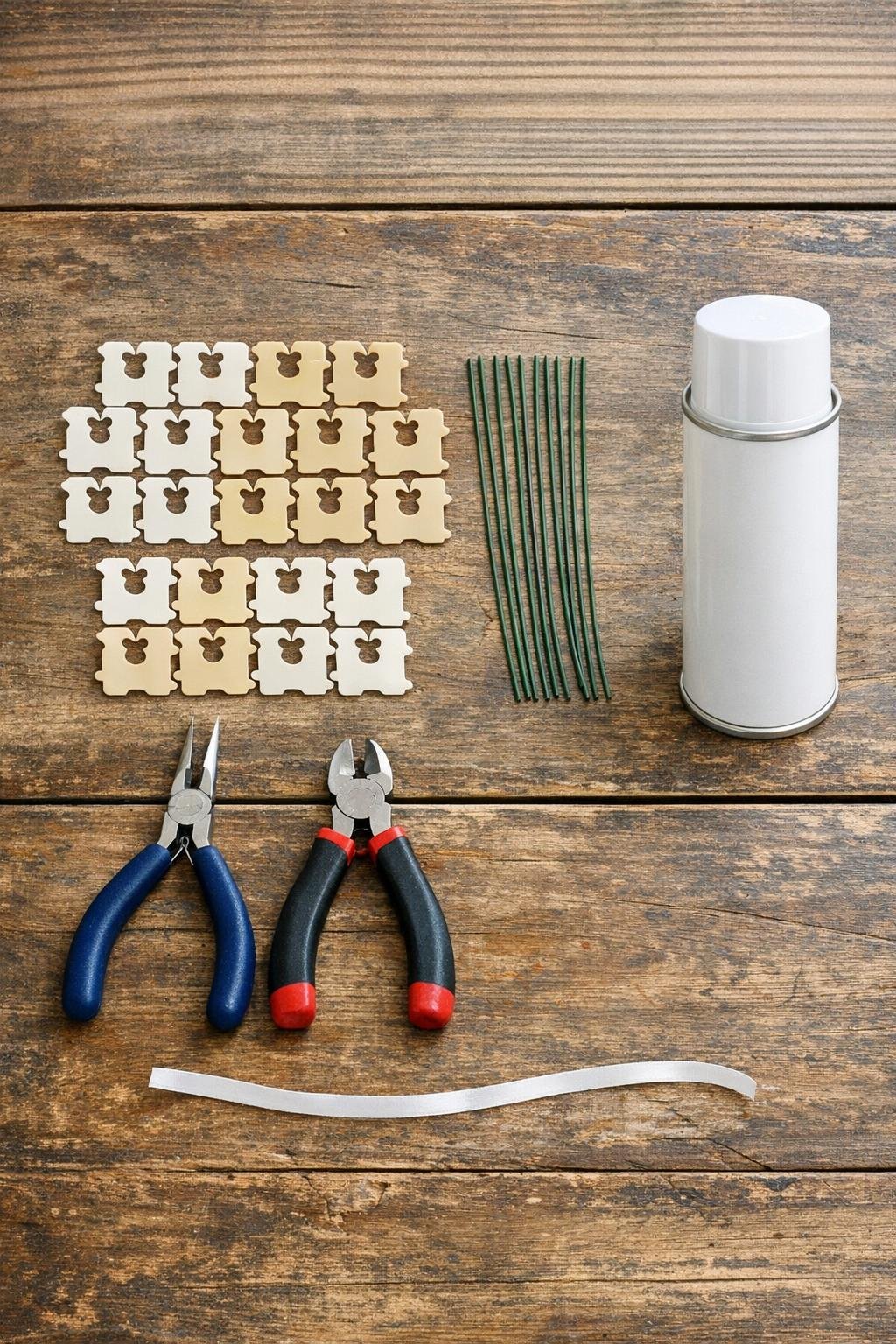 Materials for bread-clip snowflake ornaments laid out on a table