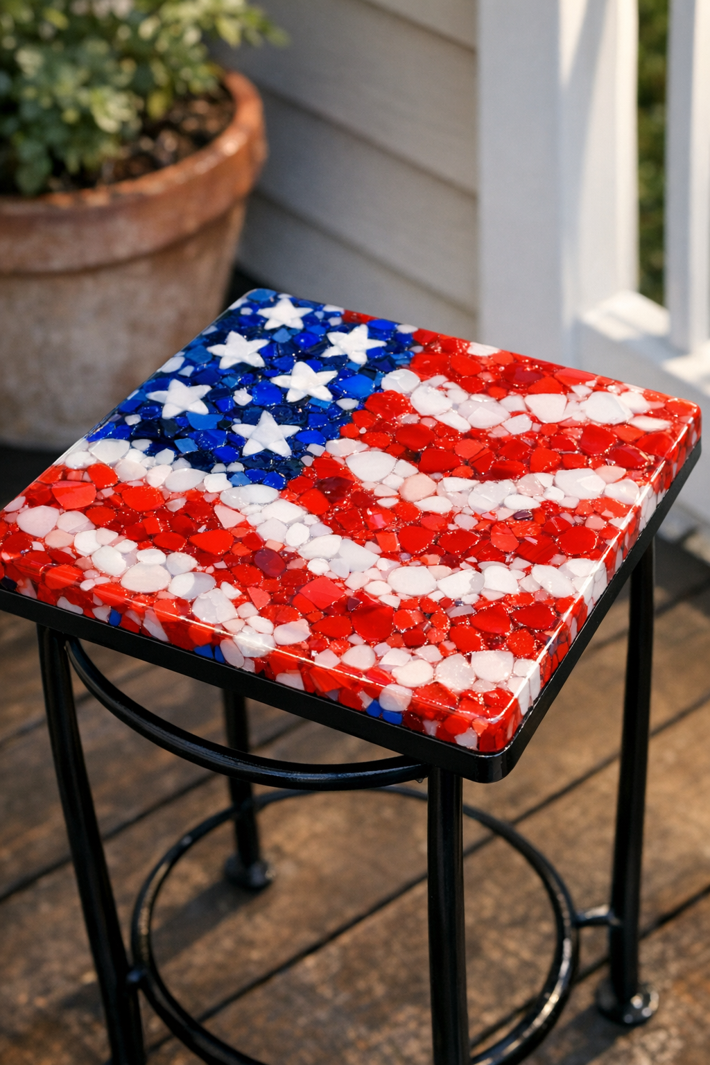 Finished patriotic outdoor tabletop made from melted plastic bottle caps