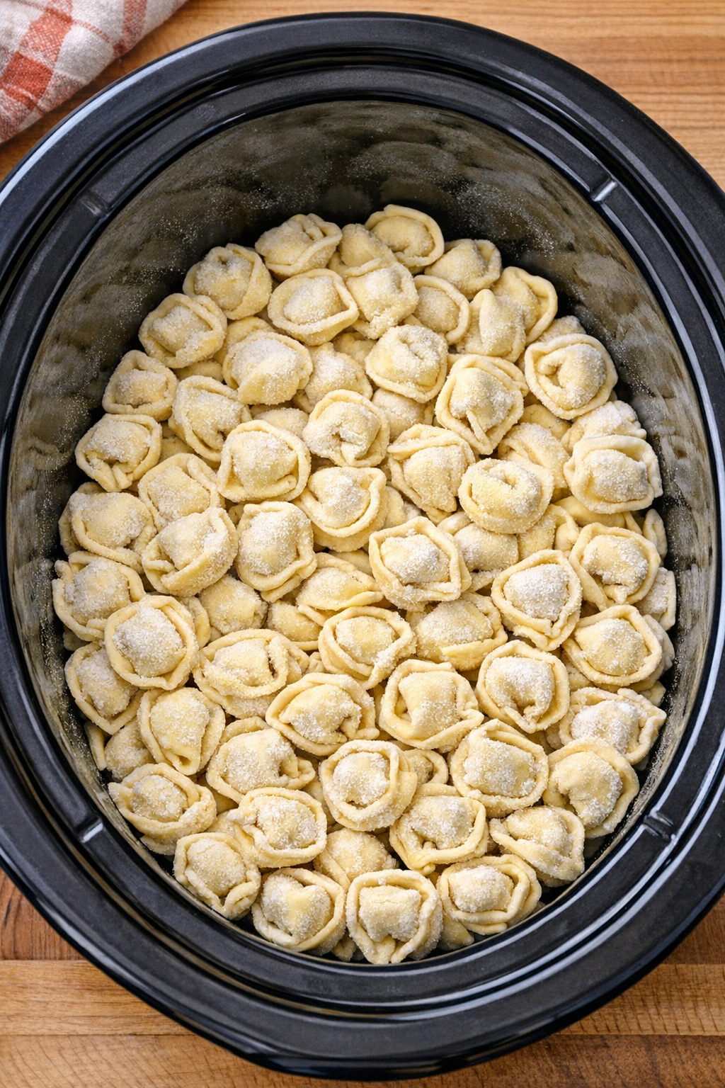Frozen tortellini spread in the slow cooker