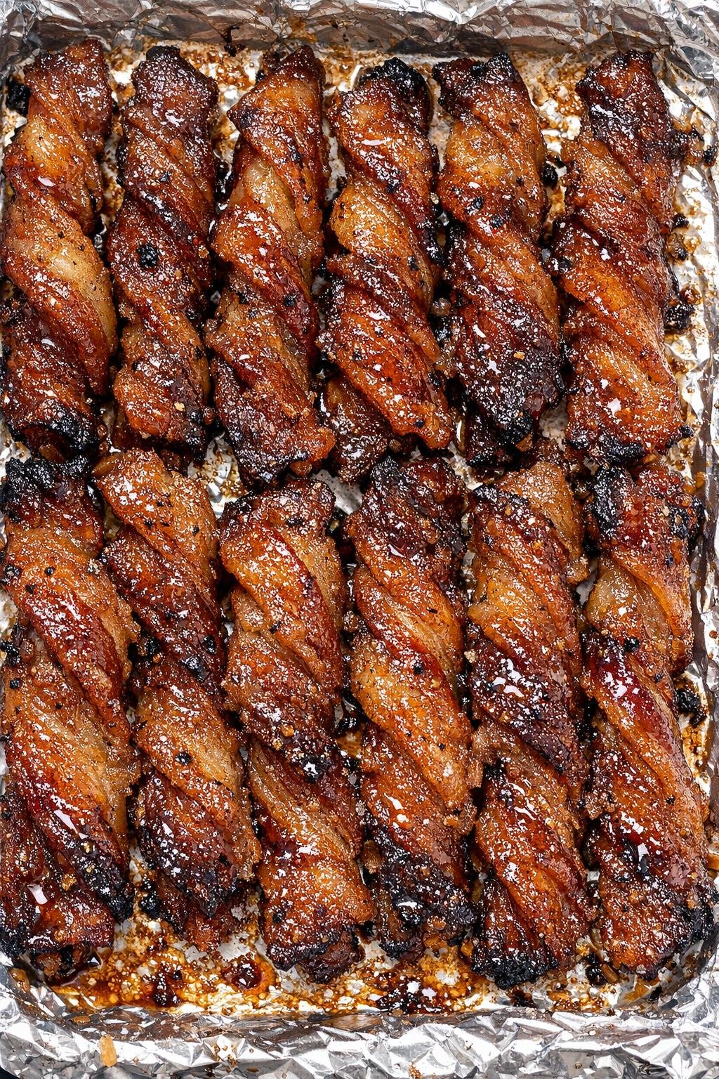 Southern brown sugar bacon twists on a foil-lined tray