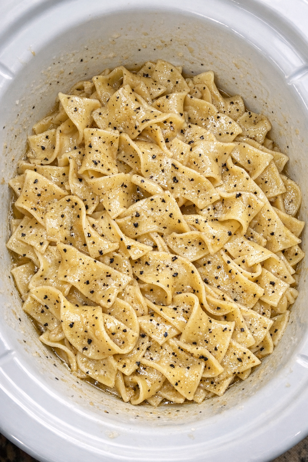 Finished Amish black pepper noodles in a white slow cooker