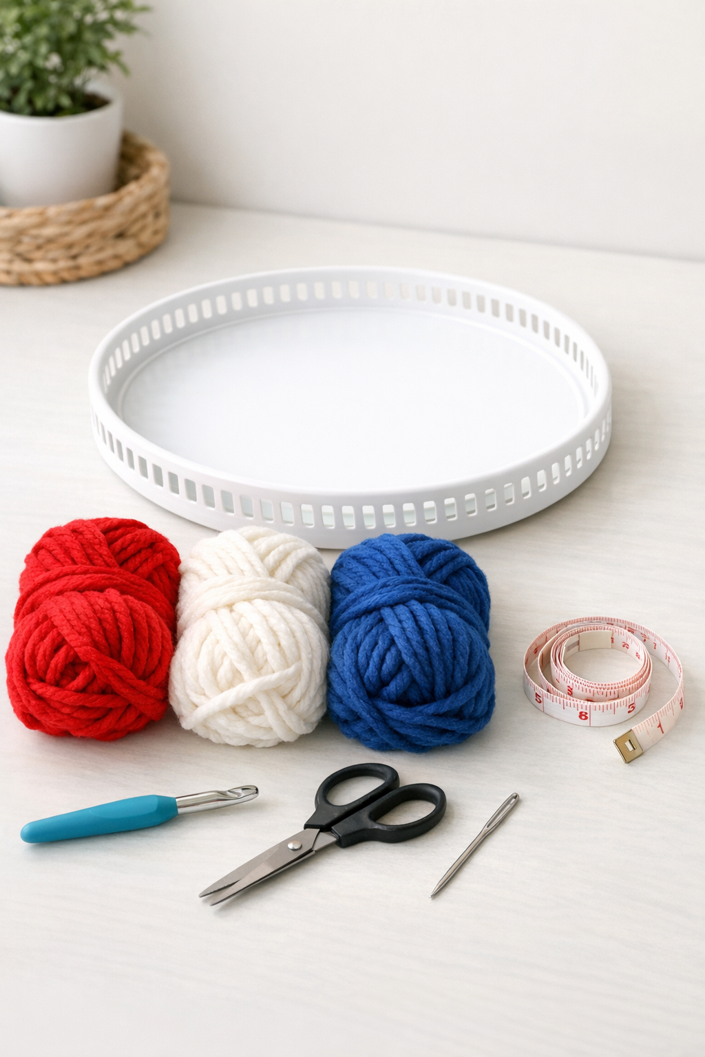 Materials for a crochet patriotic table topper arranged neatly on a table
