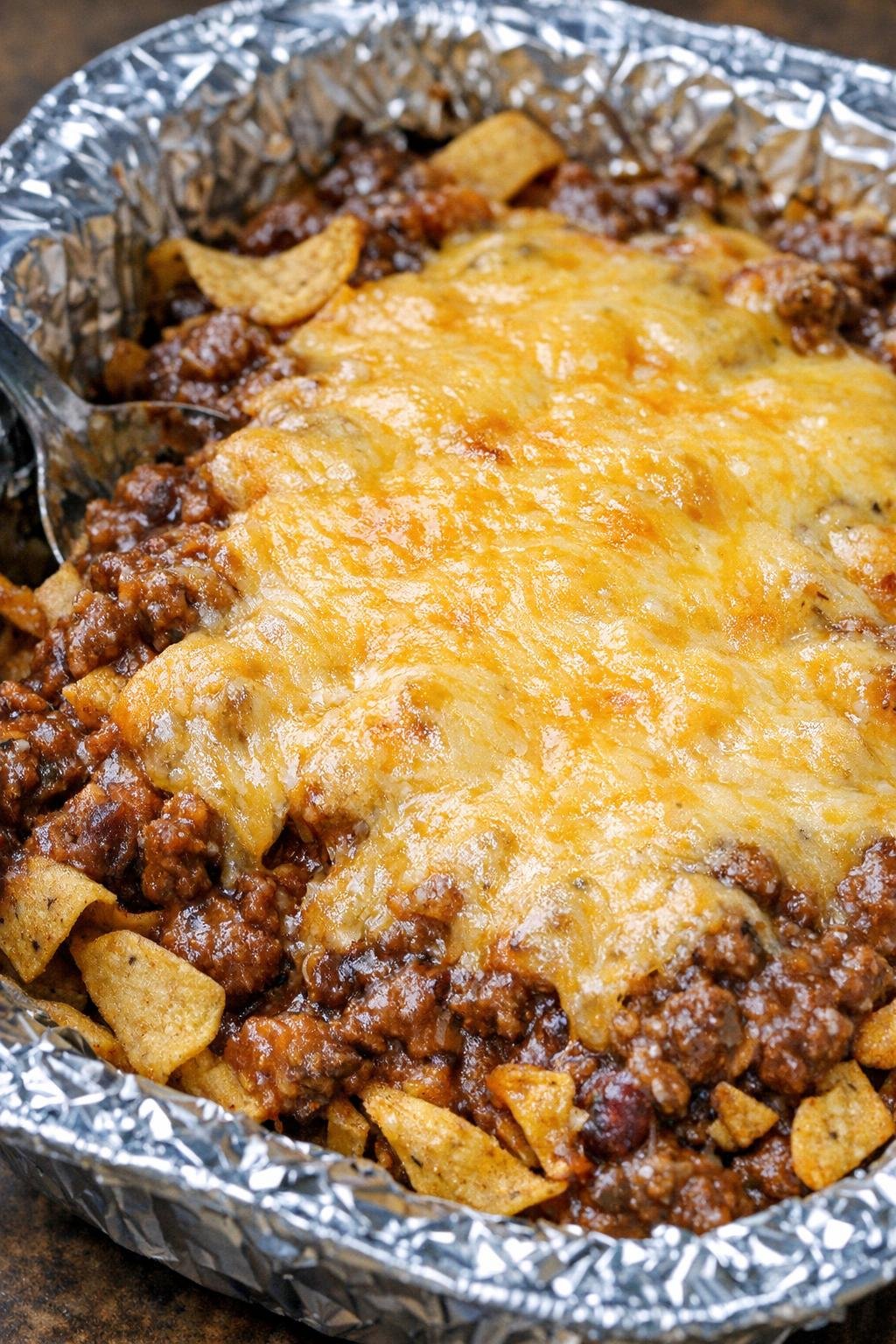 4-ingredient frito pie in a foil-lined platter