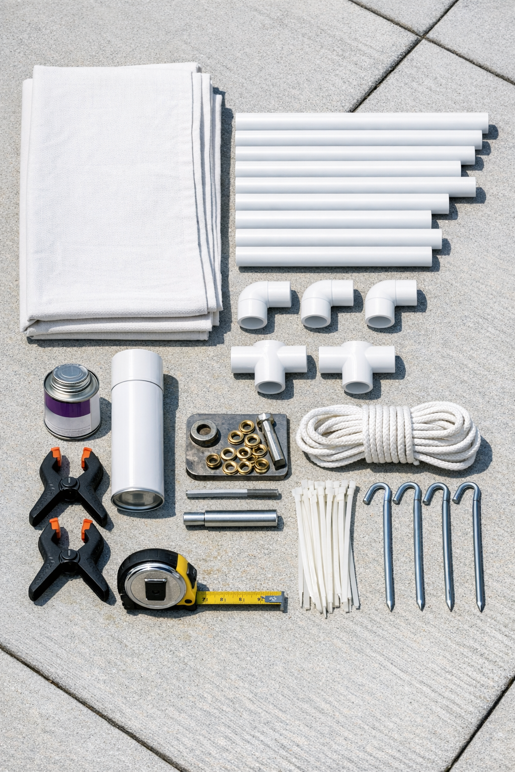 Materials for a PVC outdoor movie screen laid out on the ground