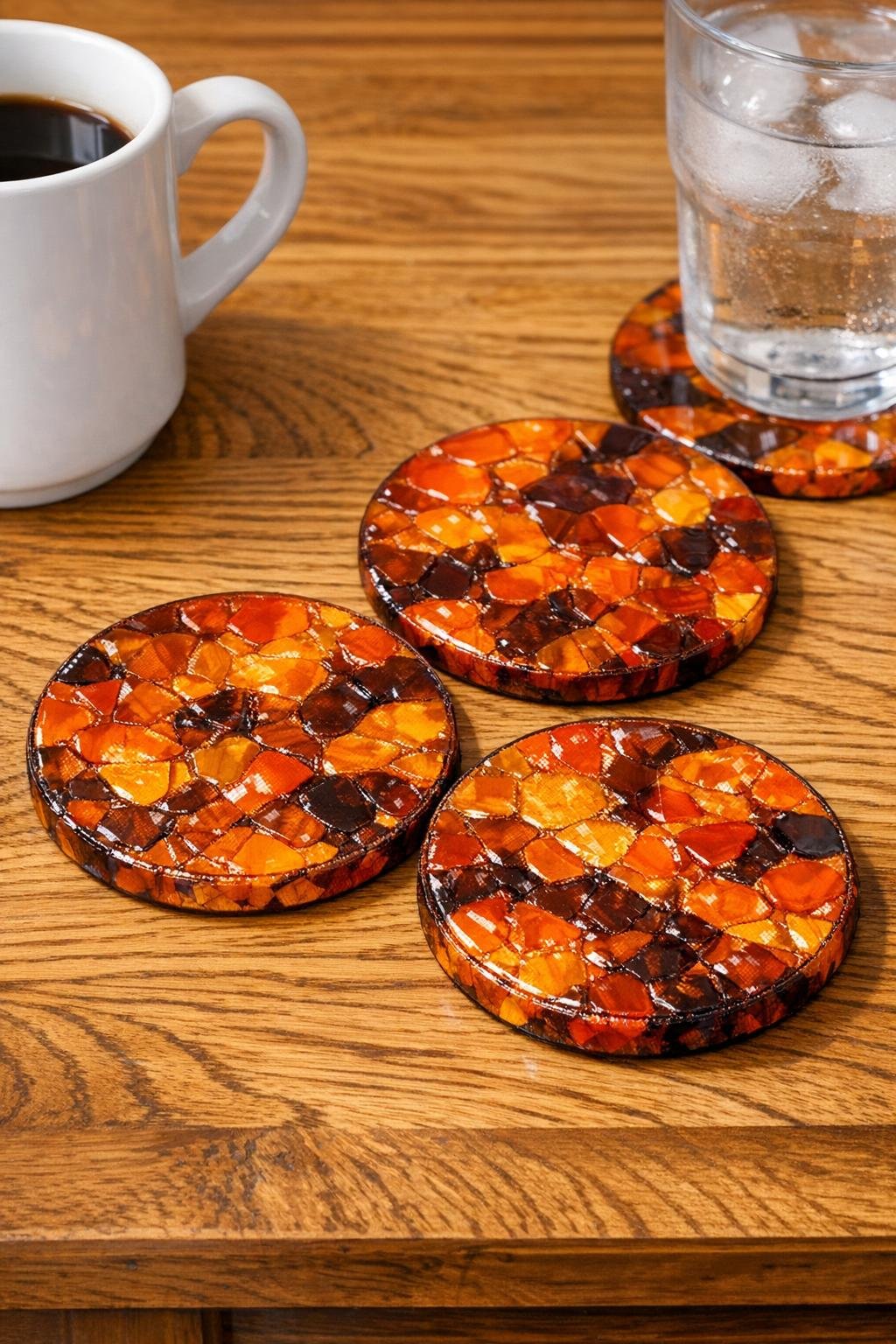Finished harvest sunset coasters made from melted orange and brown bottle caps
