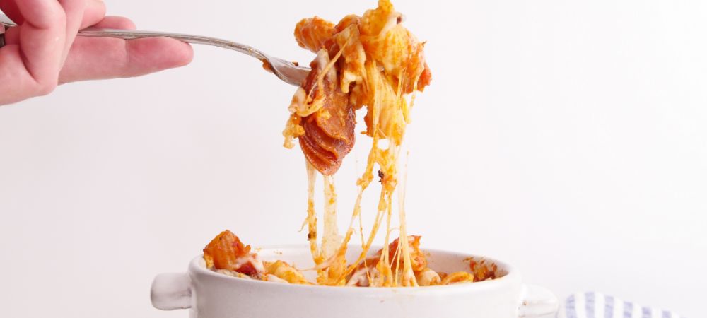 Pizza Toppings, Pasta, And Cheese Cook Together In The Slow Cooker For A Delicious Two-in-one Dish Recipe and Video