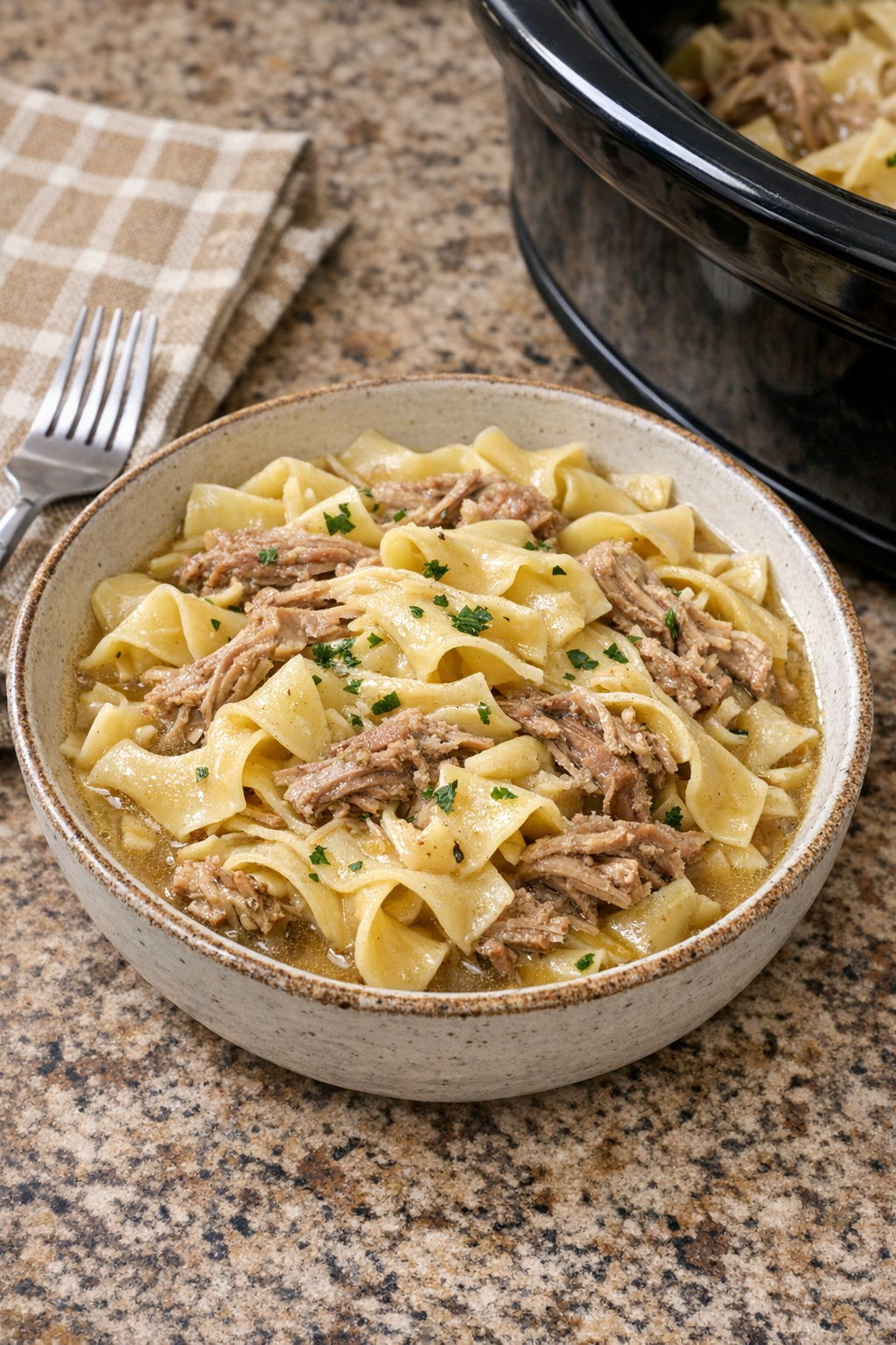 Finished Amish-style pork pasta in a serving bowl