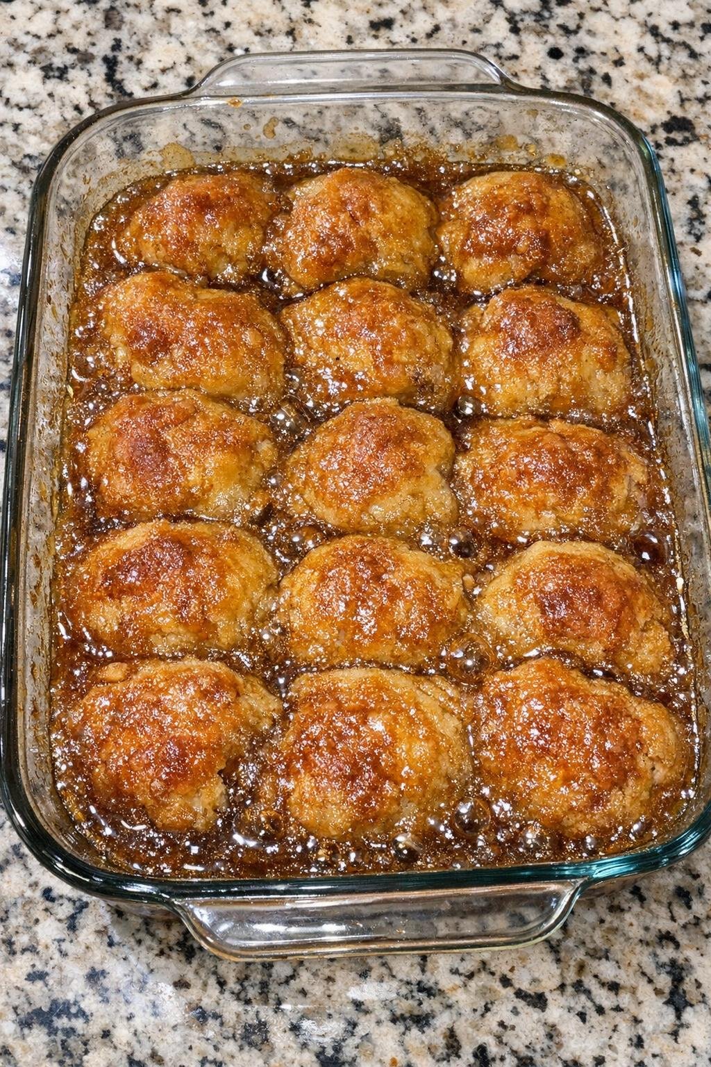 Warm apple cider dumplings in bubbling syrup