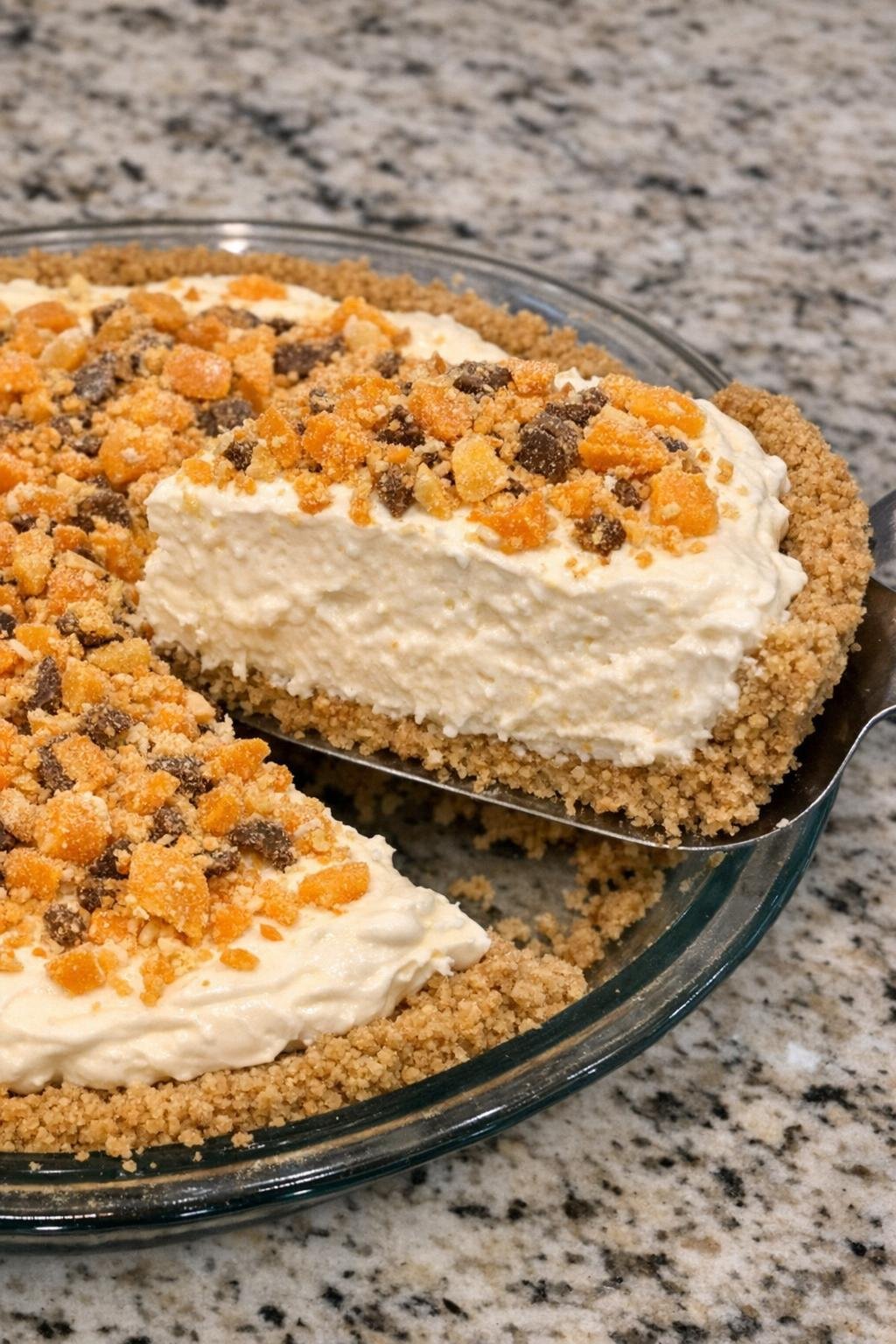 Fluffy candy-topped pie in graham crust with a lifted slice