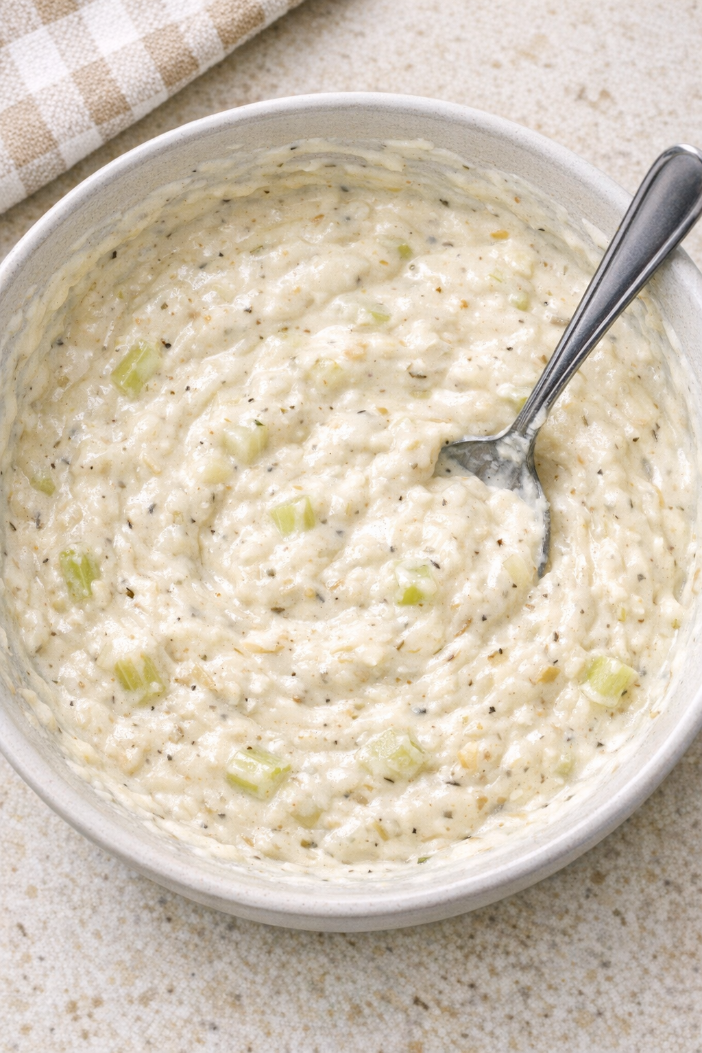 Creamy celery and onion sauce mixed in a bowl