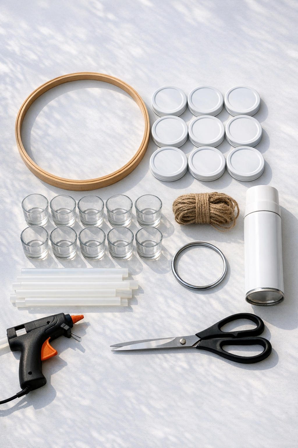 Materials laid out for a mason jar lid candle chandelier