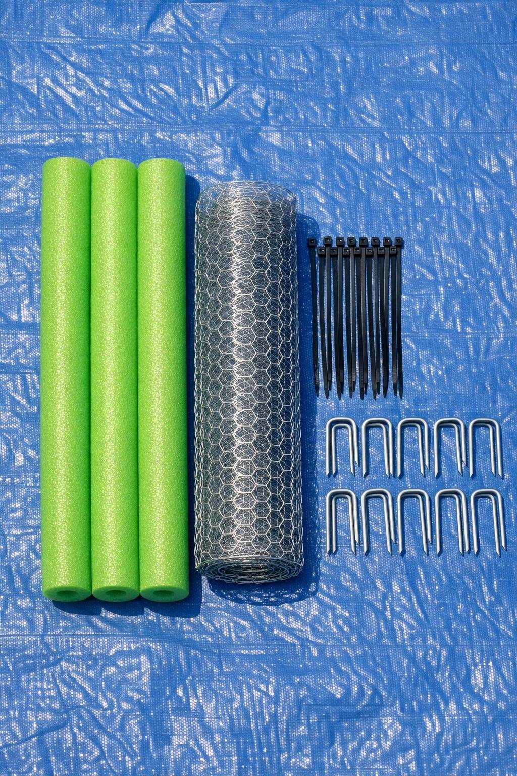 Materials for a pool noodle garden bed leaf barrier laid out together