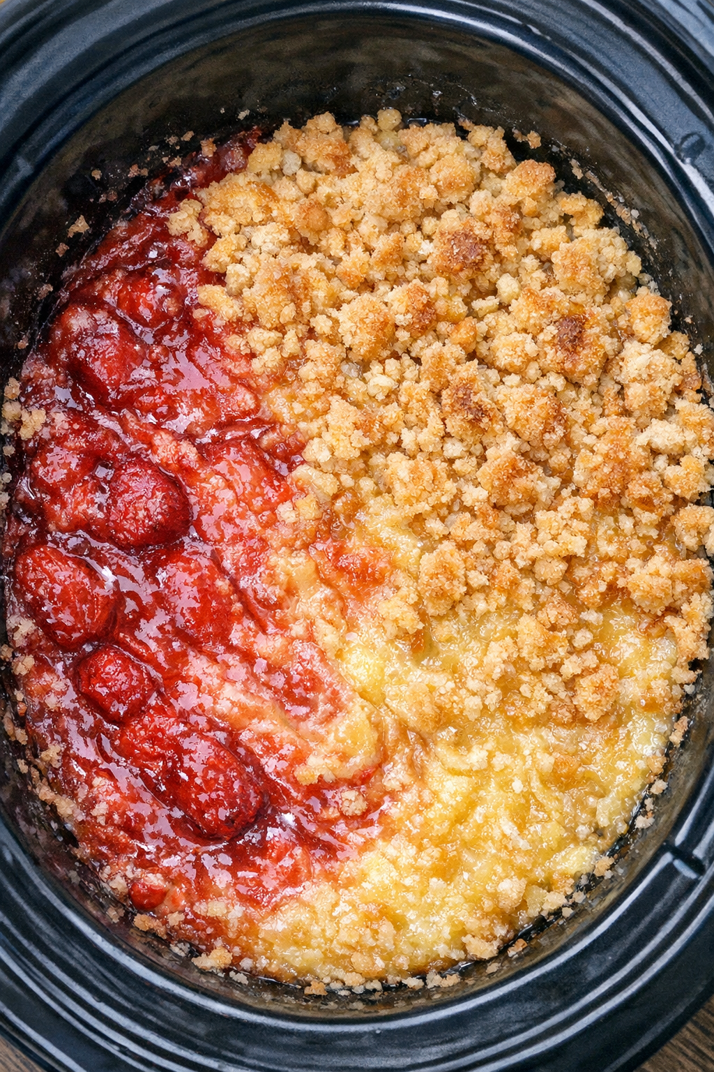 Slow cooker Miami vice dump cake in a black slow cooker