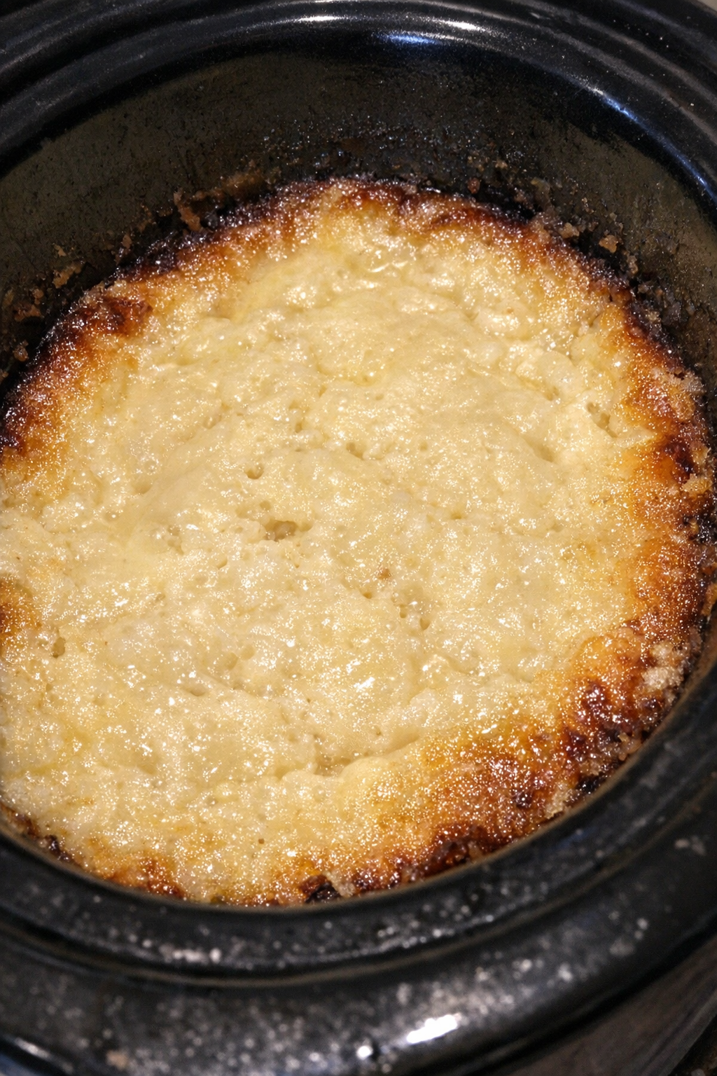 Bubbling pale ivory custard bake in a slow cooker