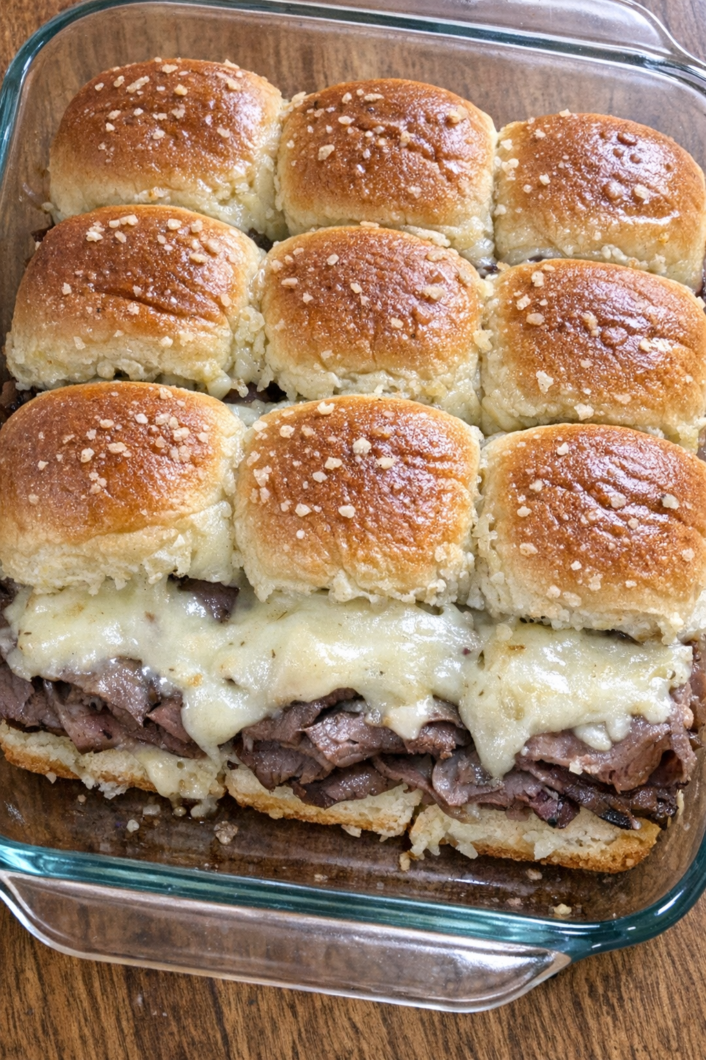 Close-up of baked beef and swiss sliders
