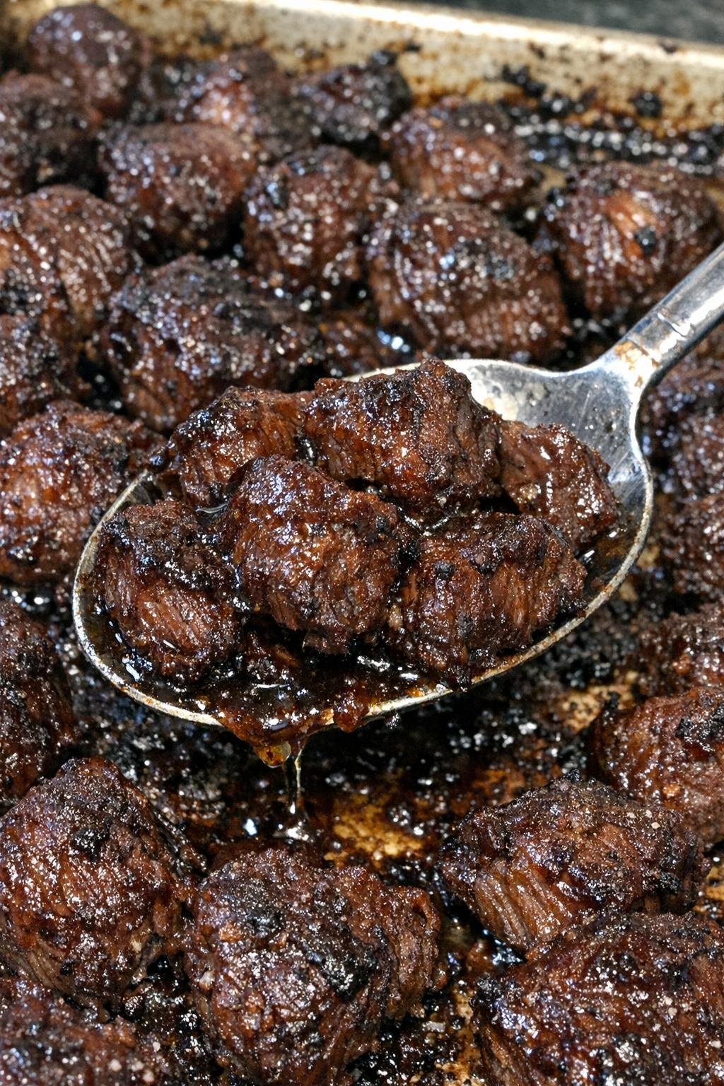 Savory beef bites with caramelized edges on a sheet pan